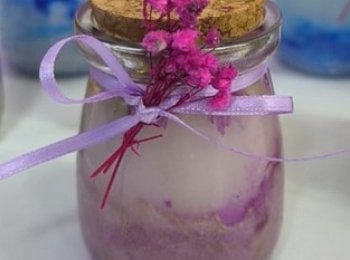 Vela marmolada en frasco de vidrio