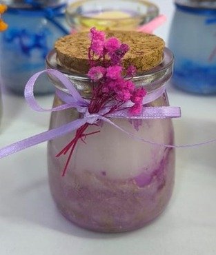 Vela marmolada en frasco de vidrio