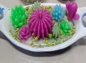 Vela terrario en maceta decorativa